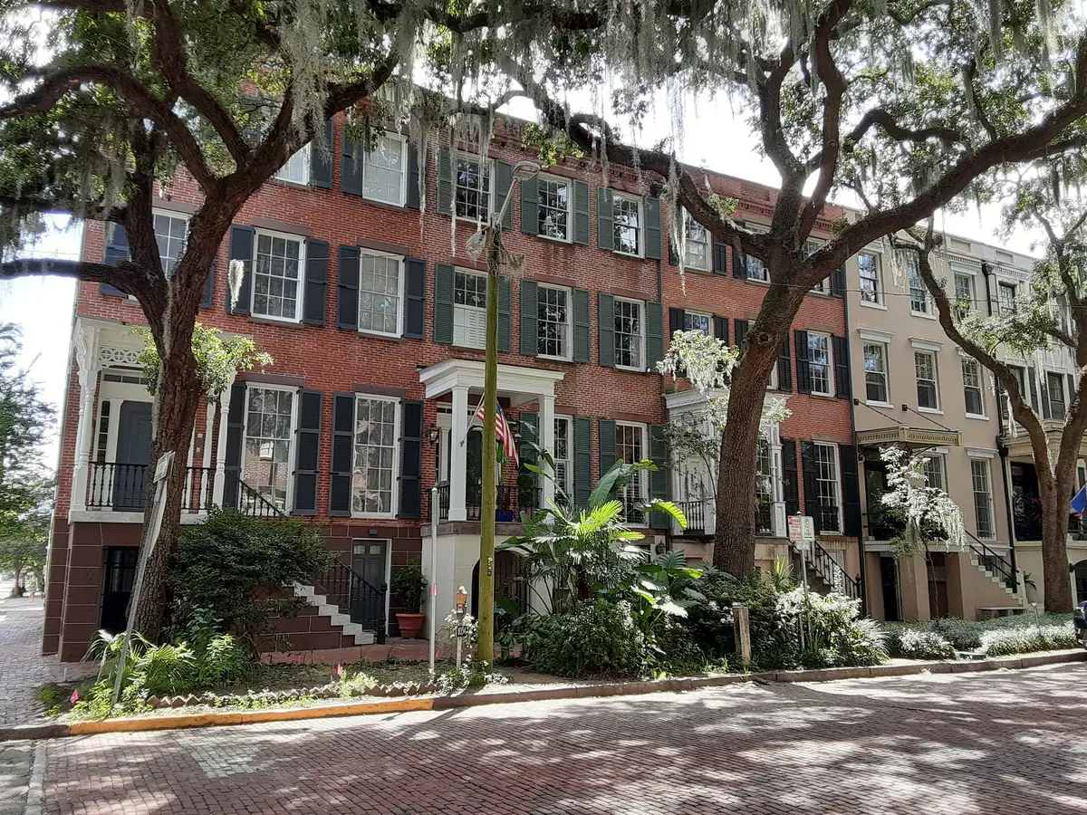 Quantock Row, brick townhouses under live oaks on Jones Street in Savannah's Historic District