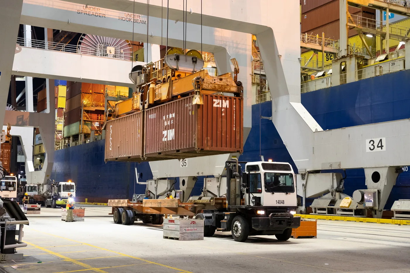 A crane lifts containers from a ship at the Port of Savannah.