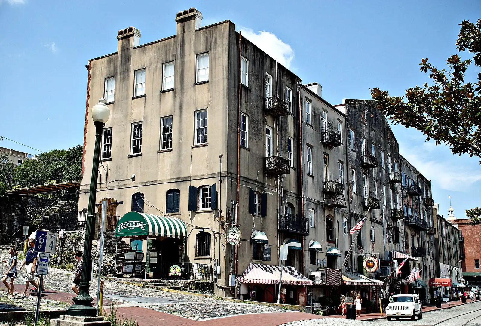 Old cotton warehouses and shops along River Street on the Savannah waterfront.