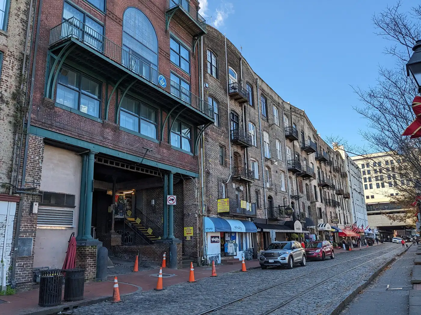 Restored warehouses facing the cobblestones of River Street in downtown Savannah.